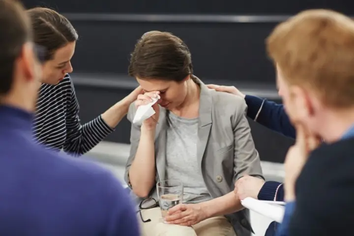 Psychologist with student under mental stress