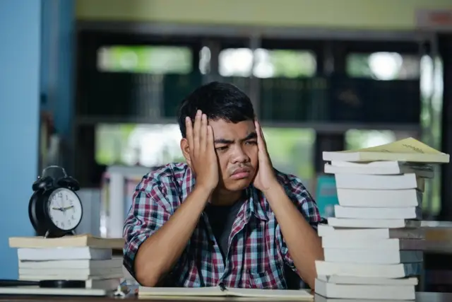 Tired Student in a Library