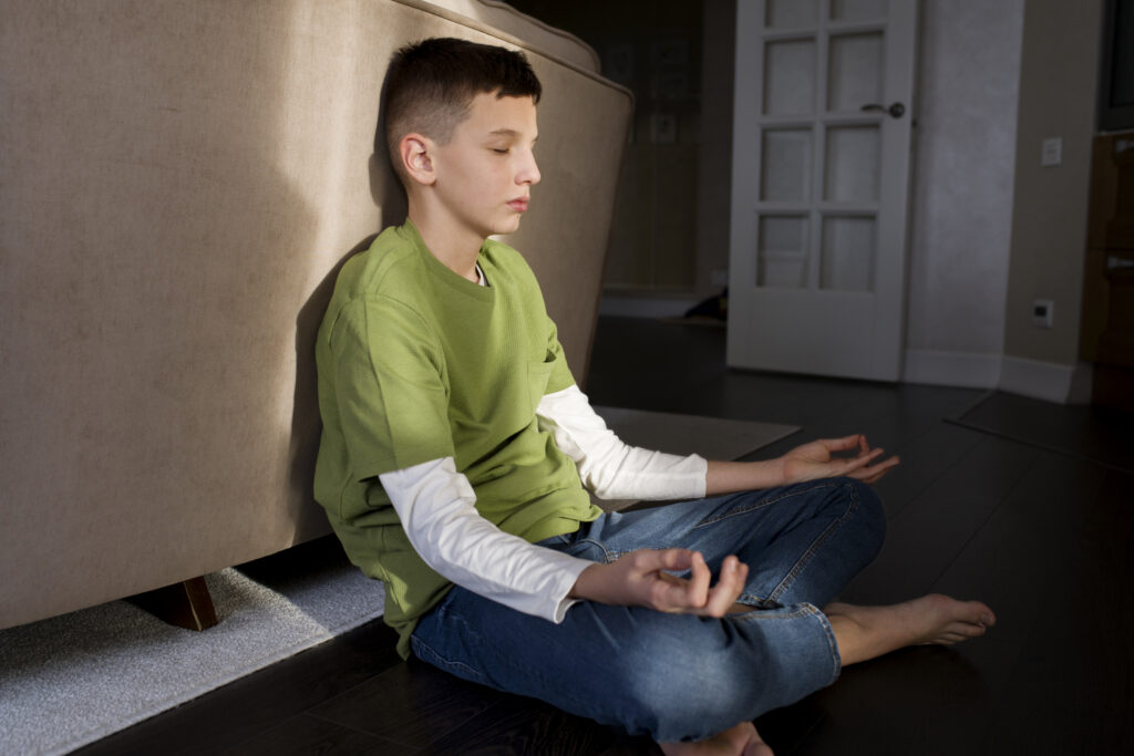 A Kid Meditating Focusing Scales