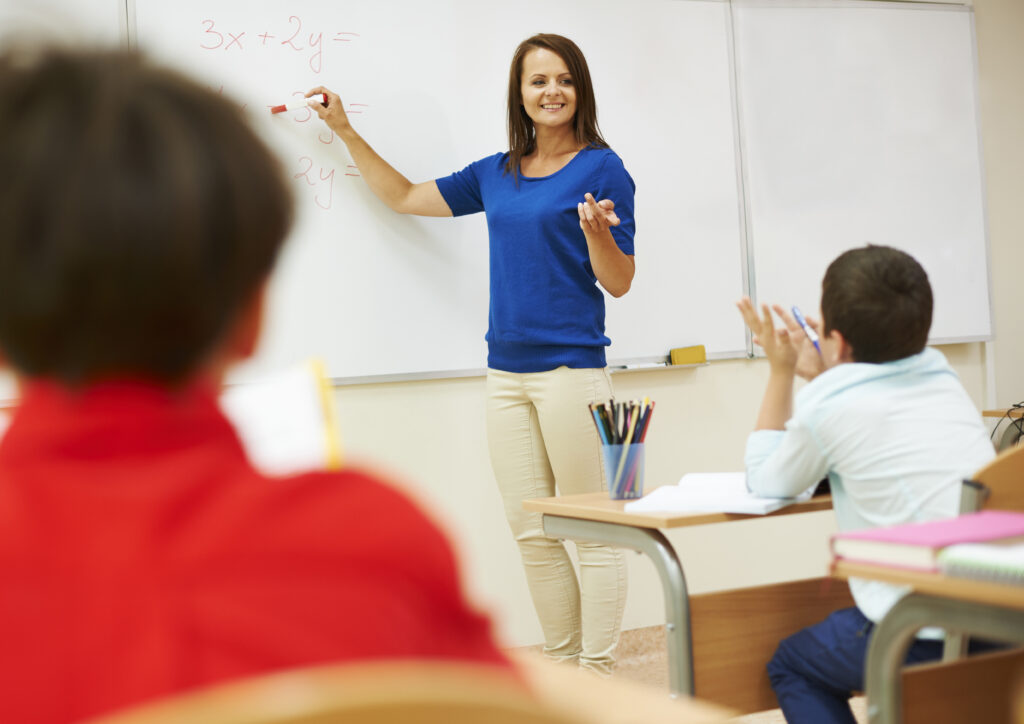 Teacher while Teaching in Classroom