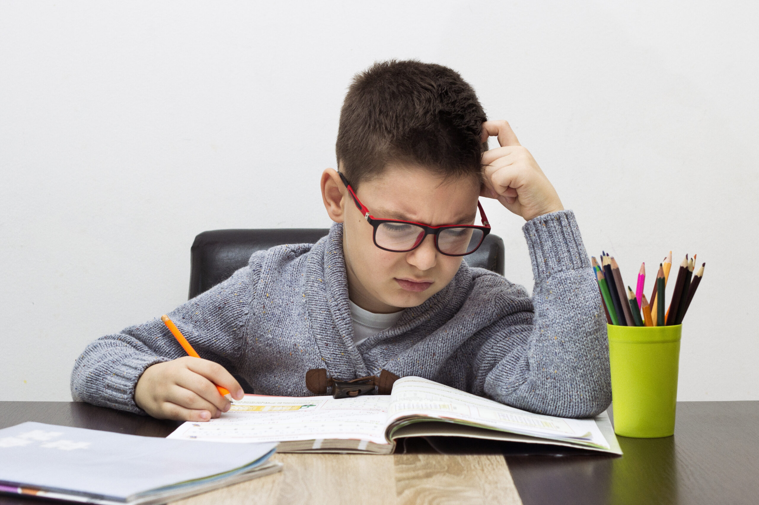 young boy frustrated over homework