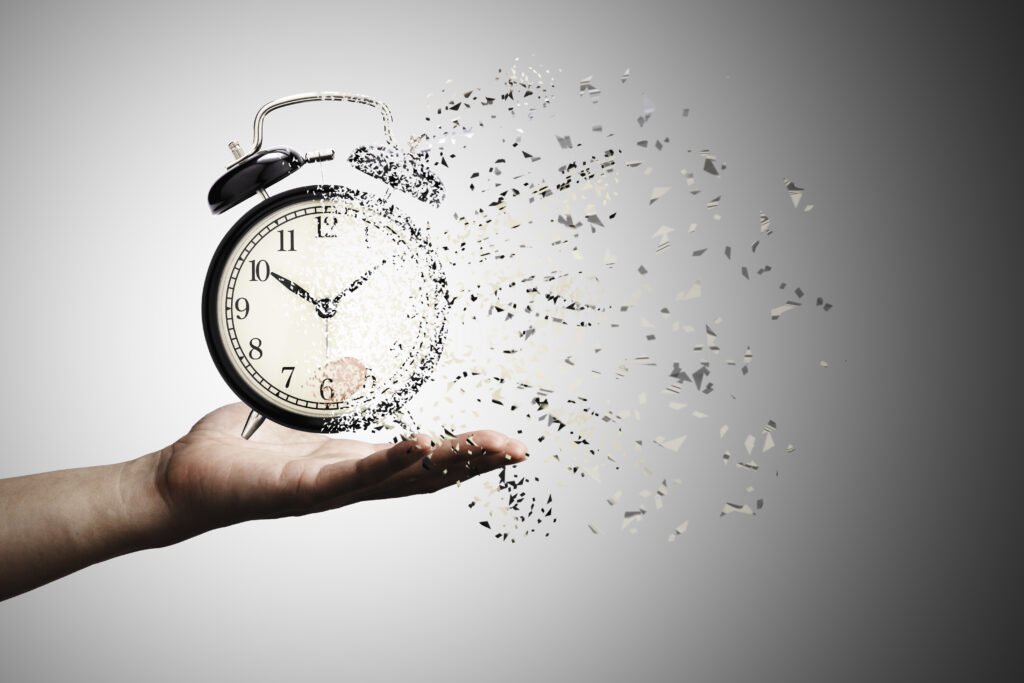 retro-black-alarm-clock-dissolving-into-little-particles-time-can-return-never-wait-anyone-time-management-concept