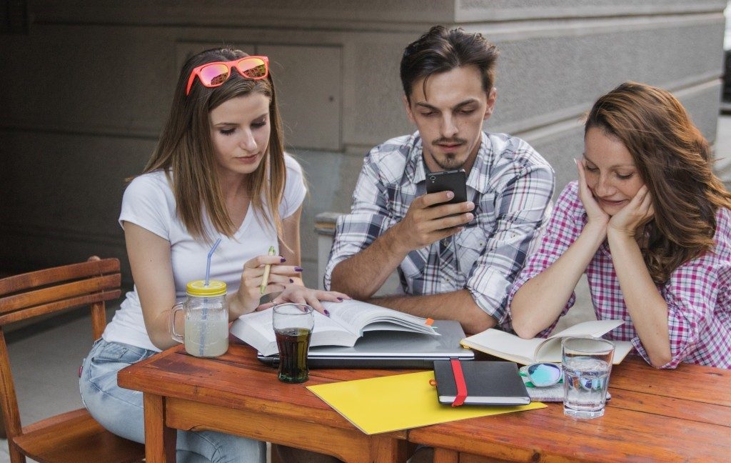 Students Collaborating in College Canteen The Benefits of Social Media for Youth