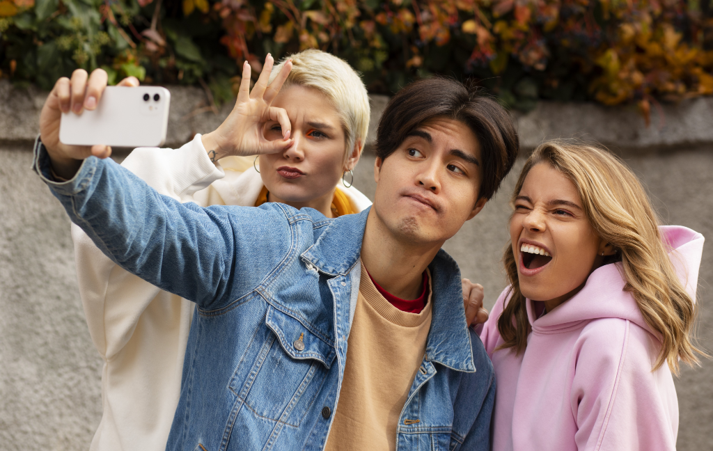 Teens making grimace expression with their faces Teens to take care of online safety
